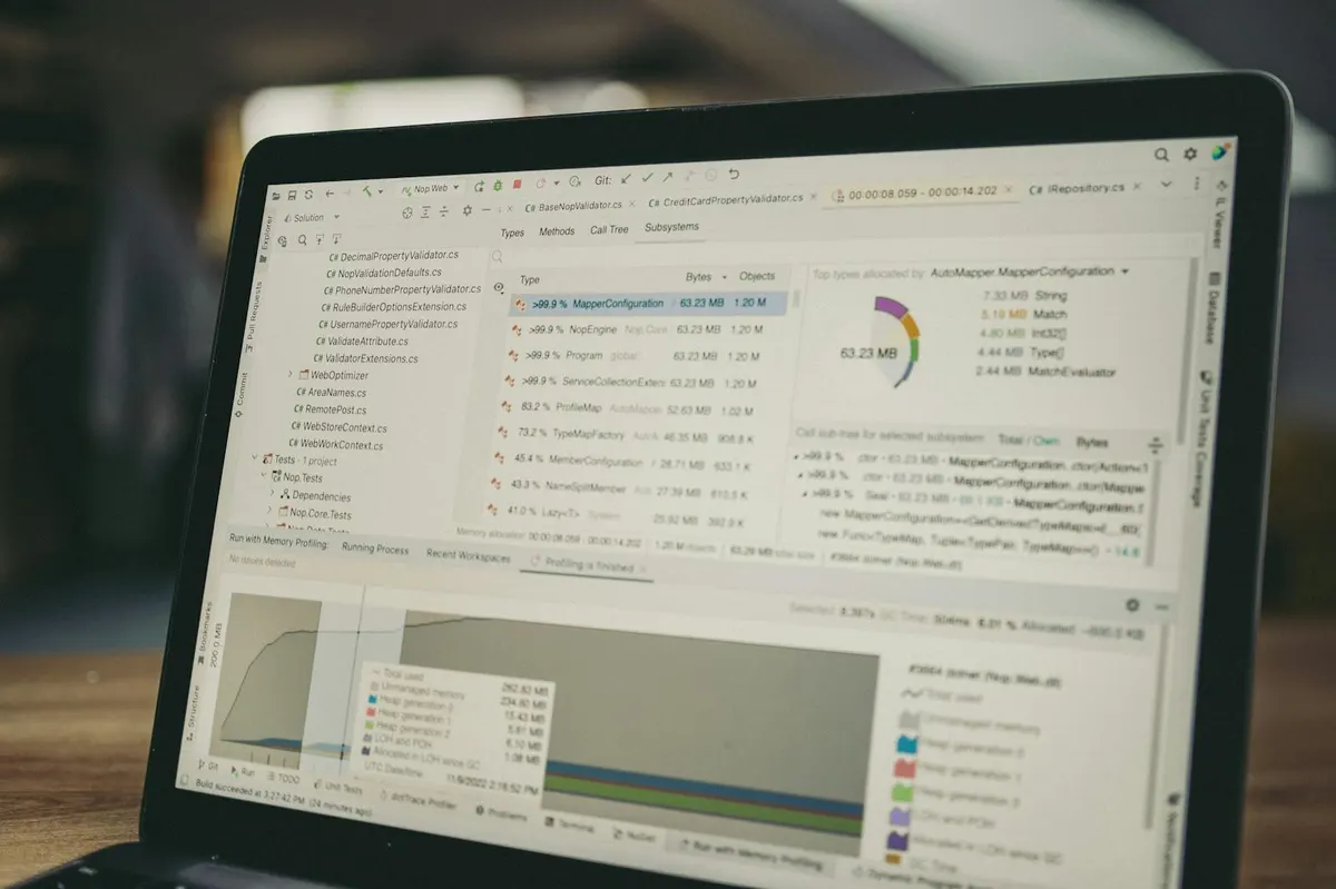 Coding and data interface on a laptop, illustrating storefront script audits and app performance review.