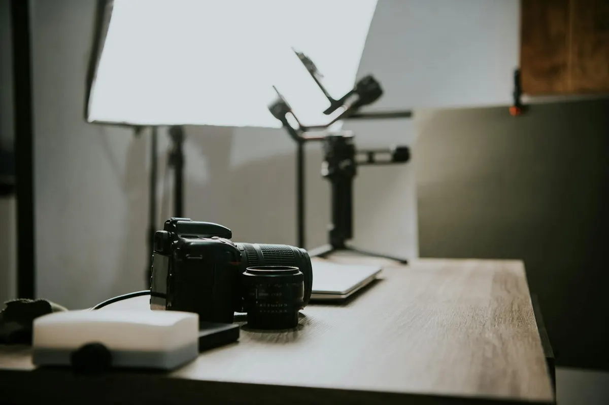 Camera on a desk, representing product photography and media optimization for Shopify storefronts.
